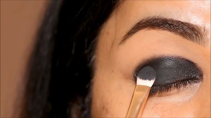 how to do a glam black smokey eye with glitter without making a mess, Applying black eyeshadow on top