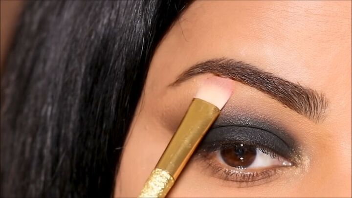 how to do a glam black smokey eye with glitter without making a mess, Highlighting the brow bone