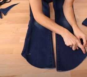 how to fray jeans in 7 different ways distress crop fray more, Cutting the length of the jeans on a curve