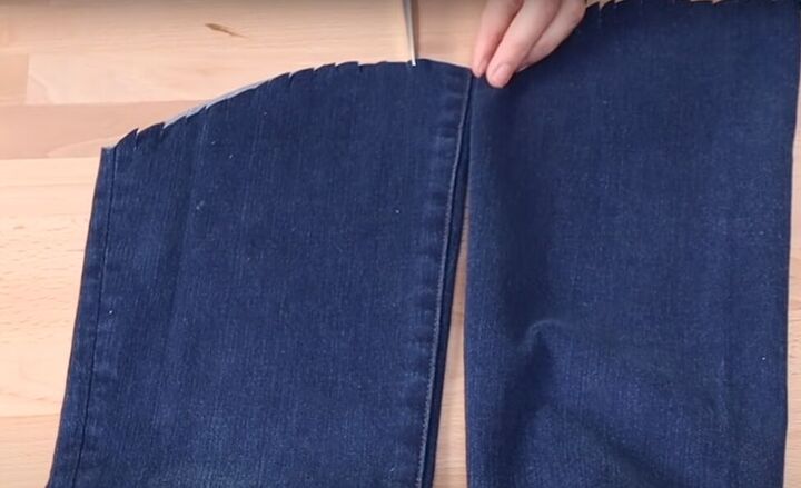 how to fray jeans in 7 different ways distress crop fray more, Snipping small cuts around the hem