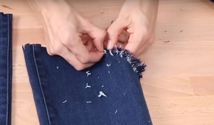 how to fray jeans in 7 different ways distress crop fray more, Pulling at the threads