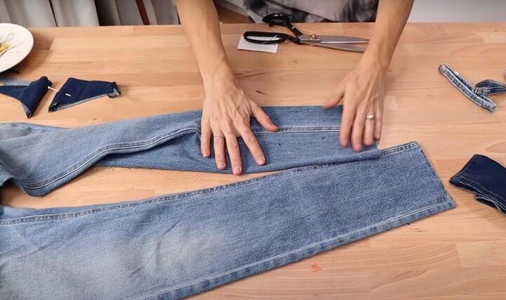 how to fray jeans in 7 different ways distress crop fray more, Cutting off the existing hem