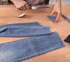 how to fray jeans in 7 different ways distress crop fray more, Cutting a U shape at the bottom of the jeans