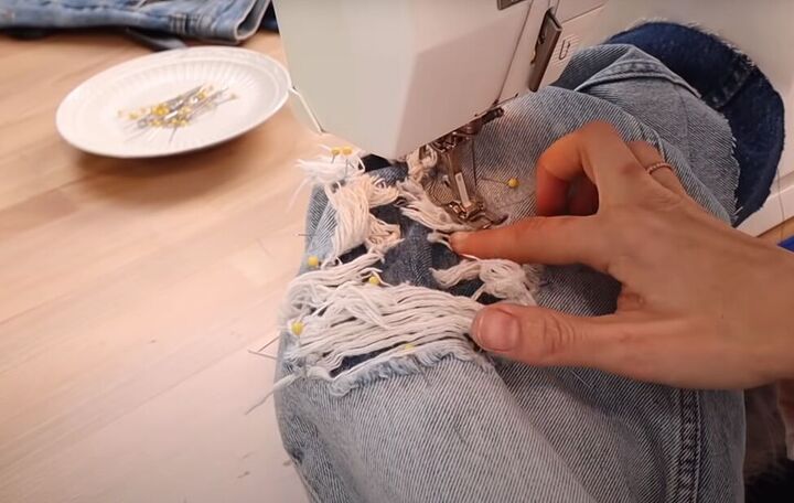 how to fray jeans in 7 different ways distress crop fray more, Sewing the patches