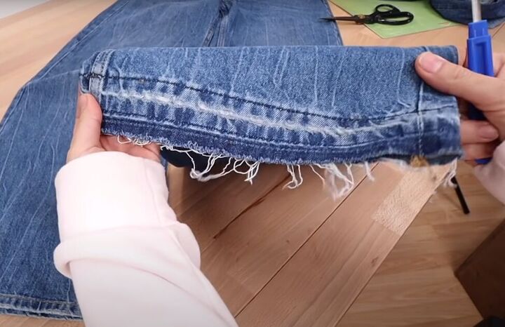 how to fray jeans in 7 different ways distress crop fray more, Releasing the hem of the jeans