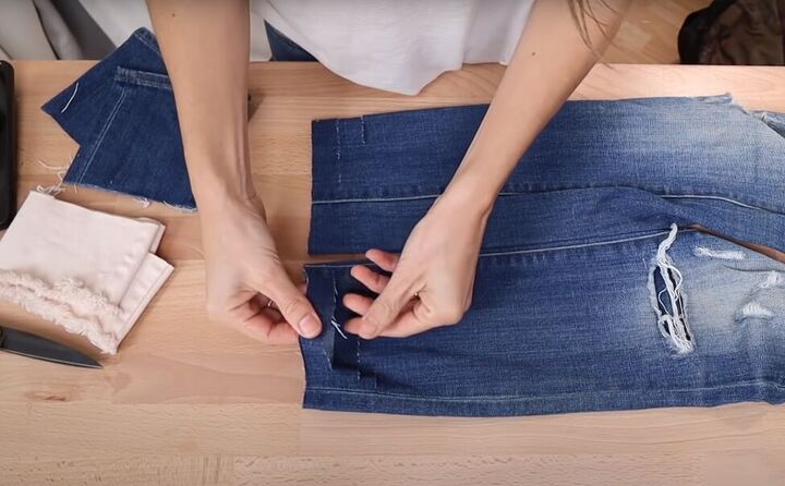 how to fray jeans in 7 different ways distress crop fray more, Cutting the bottom of the jeans