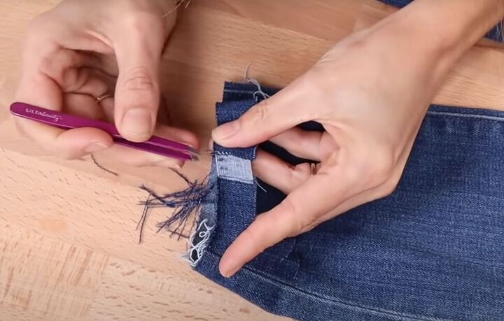 how to fray jeans in 7 different ways distress crop fray more, Using tweezers to pull out threads