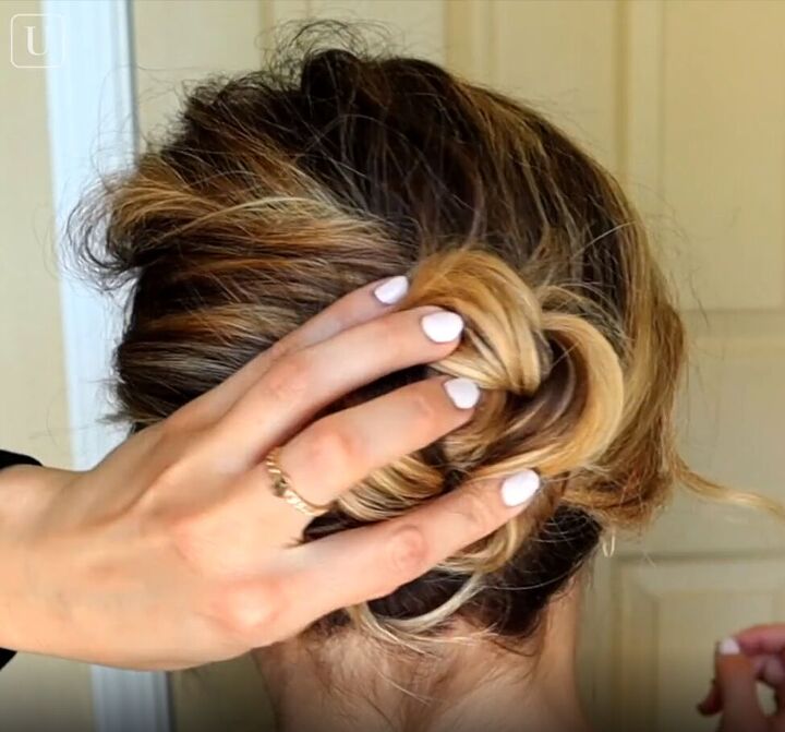 7 quick easy french pin hairstyles that look effortlessly chic, Twisting the braid into a bun