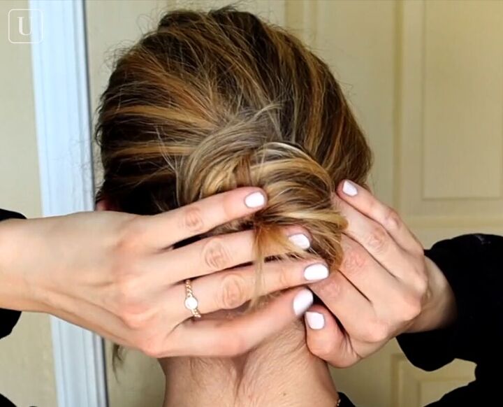 7 quick easy french pin hairstyles that look effortlessly chic, Twisting hair into a messy bun