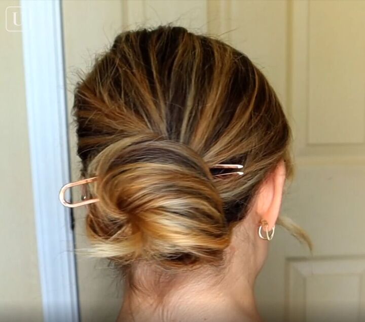 7 quick easy french pin hairstyles that look effortlessly chic, Inserting the u shaped pin from the side