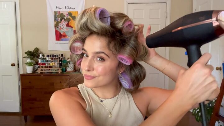 how to get big supermodel esque 90s blowout hair in 5 easy steps, Blasting the rollers with a hair dryer