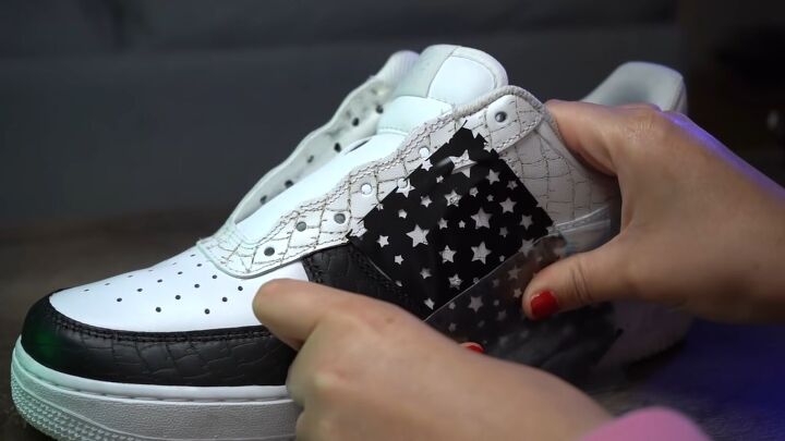 how to make textured diy croc skin sneakers with a wood burning tool, Applying stencils to the sneakers