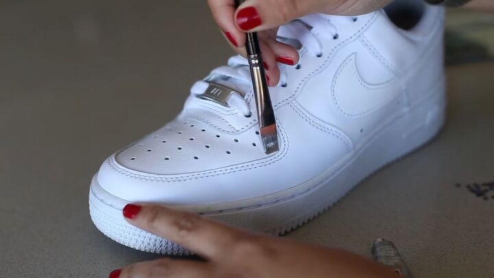 how to make sparkly diy rhinestone sneakers in a few simple steps, Applying E6000 glue to the sneakers