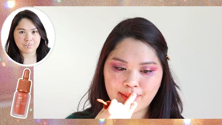 this cute pink purple smokey eye look is perfect for summer, Applying lip tint to lips