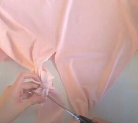 how to make a wrap top out of a t shirt without sewing a stitch, Snipping off the excess fabric