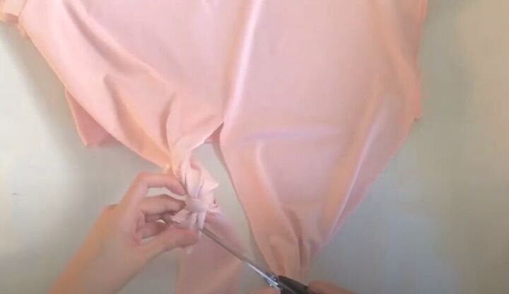 how to make a wrap top out of a t shirt without sewing a stitch, Snipping off the excess fabric
