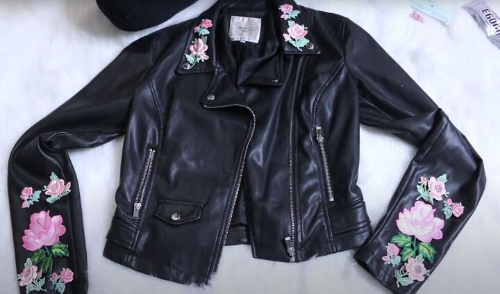 how to make a cute diy floral moto jacket using appliques, Placing the floral appliques on the jacket