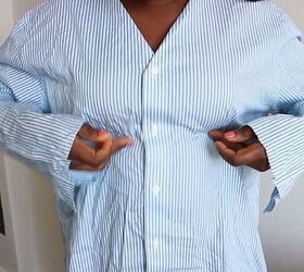 how to make a cute diy peplum top out of an old men s shirt, Trying on the shirt to determine the size