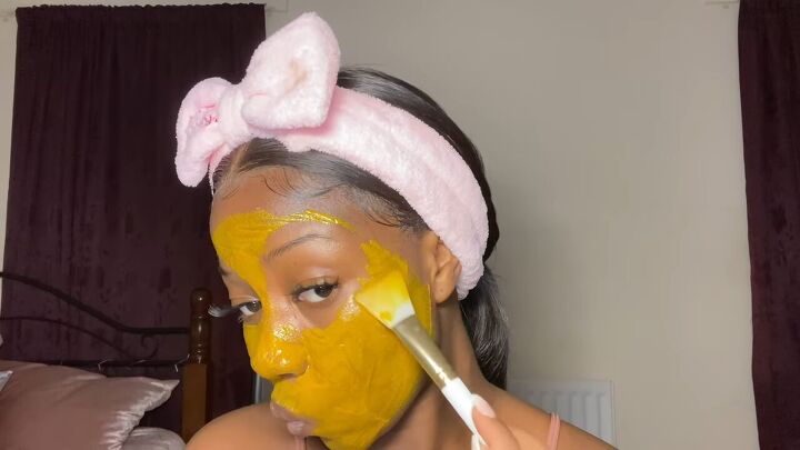 how to make a brightening face mask to fade blemishes in 4 easy steps, Applying mask to face with a brush