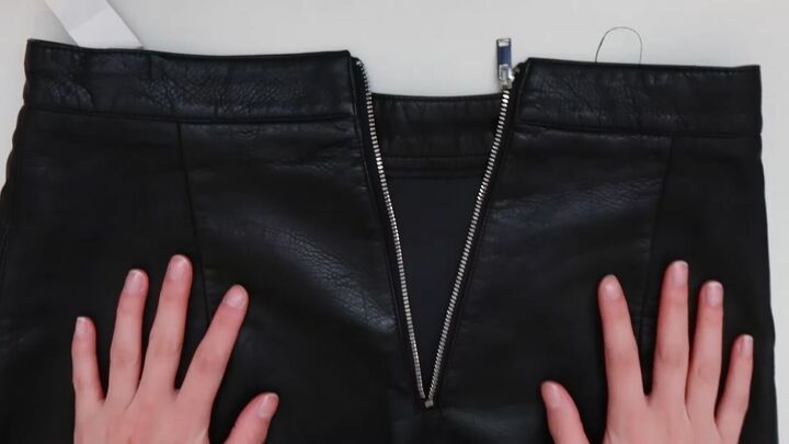 how to downsize jeans fix a broken zipper mend your clothes, Leather skirt with a broken zipper