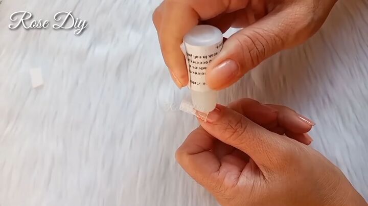 how to make fake nails with toilet paper baby powder, Applying nail glue over the top