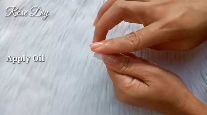 how to make fake nails with toilet paper baby powder, Applying nail oil