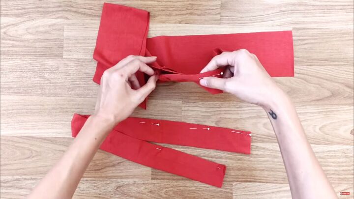 how to make a gorgeous diy wrap dress out of 2 t shirts, Folding and pinning the ties