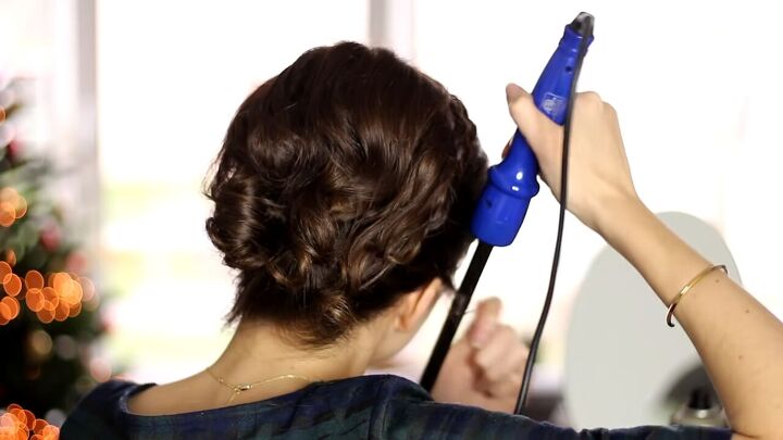 10 steps to create a beautiful braided audrey hepburn hairstyle, Using a curling iron to curl side pieces of hair in the front