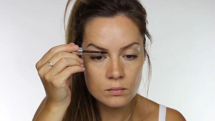 try this soft light summer makeup without foundation, Grooming eyebrows with brow gel