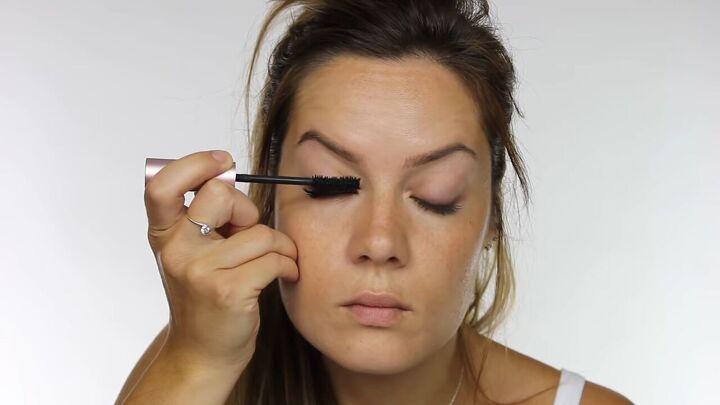 try this soft light summer makeup without foundation, Applying mascara to lashes