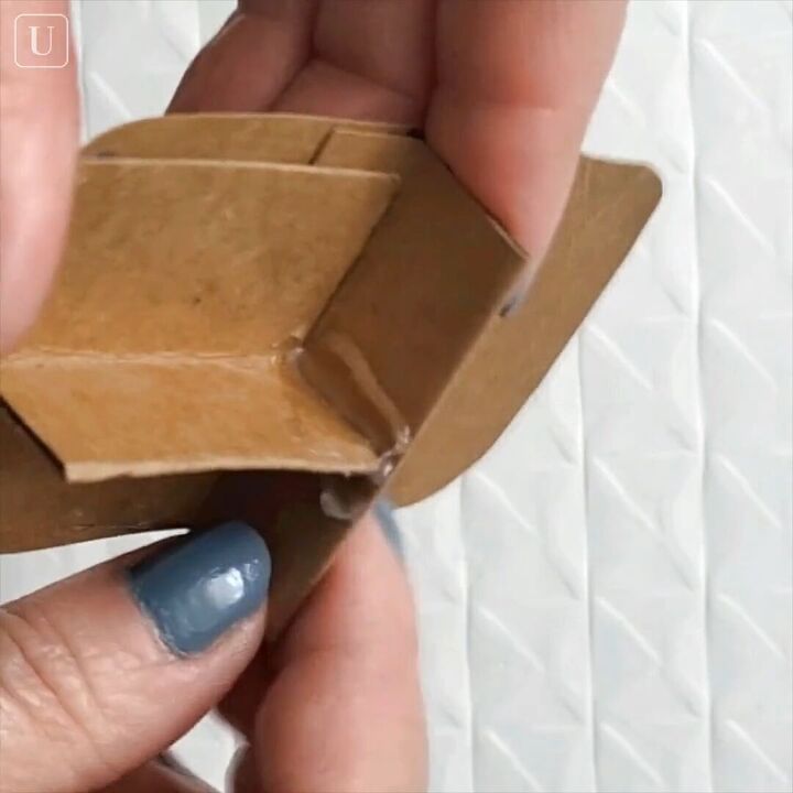 how to make a diy small jewelry box out of an old mint tin, Adding glue to the walls to make them sturdy