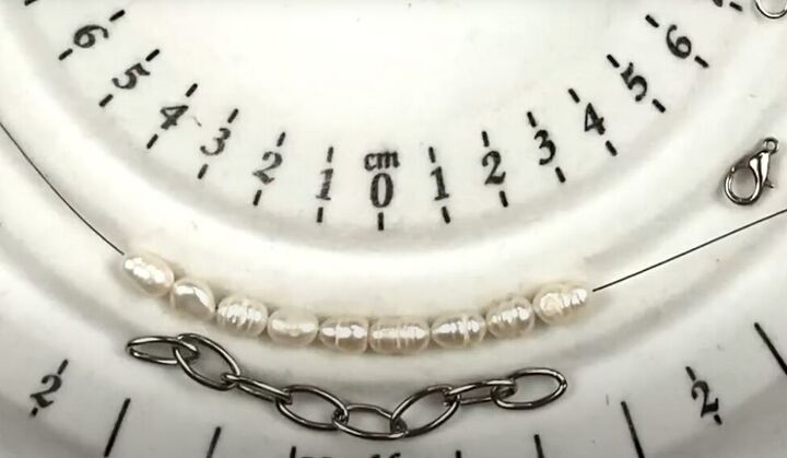 how to use old necklaces to make a pretty diy pearl chain bracelet, Stringing the pearls onto beading wire