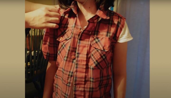 how to upcycle a men s shirt into a feminine top, Trying on the DIY top to gauge the fit