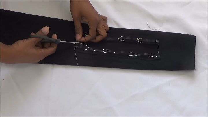 make your own trendy lace up pants, Cutting off excess thread