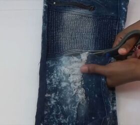 how to quickly turn your old distressed jeans into a stylish skirt, Cutting the bottom half of jean legs