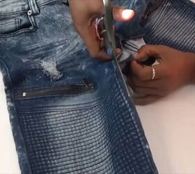 how to quickly turn your old distressed jeans into a stylish skirt, Cutting down the inner seam of jeans