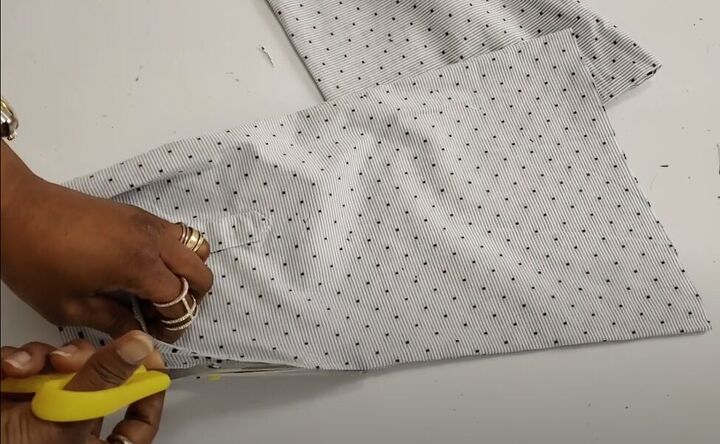 how to turn a men s shirt into a cute top in a few simple steps, Cutting open the sleeve side seams