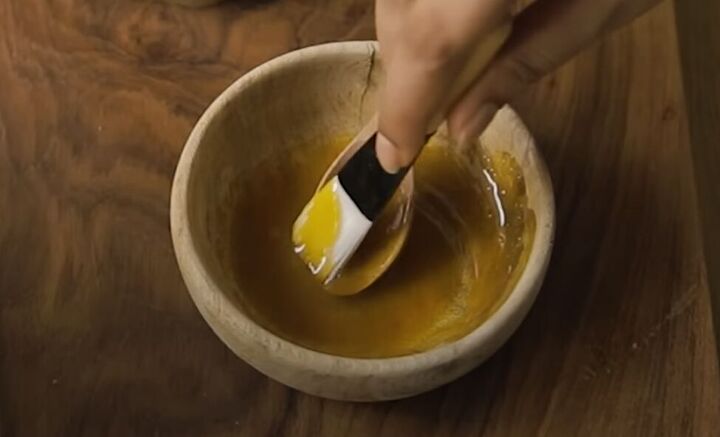 how to make a brightening turmeric eye mask face mask, Mixing honey and turmeric powder