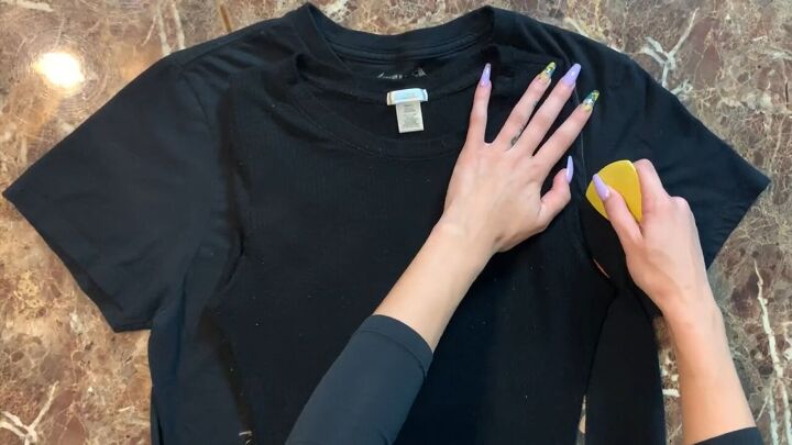 how to make a diy o ring crop top out of a band t shirt, Tracing the new shape