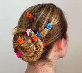 4 cute hairstyles with wet hair that are quick easy to do, Securing the bun with colorful hair clips