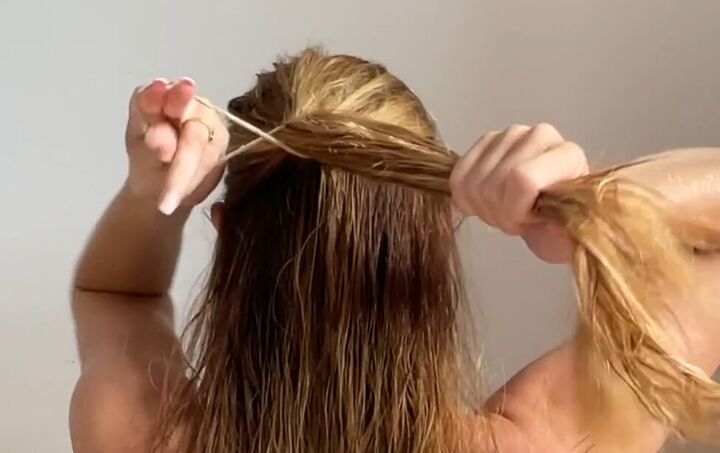 4 cute hairstyles with wet hair that are quick easy to do, Tying hair into a half ponytail
