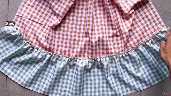 how to make a cute diy patchwork dress out of gingham scraps, Pinning the ruffle to the side piece
