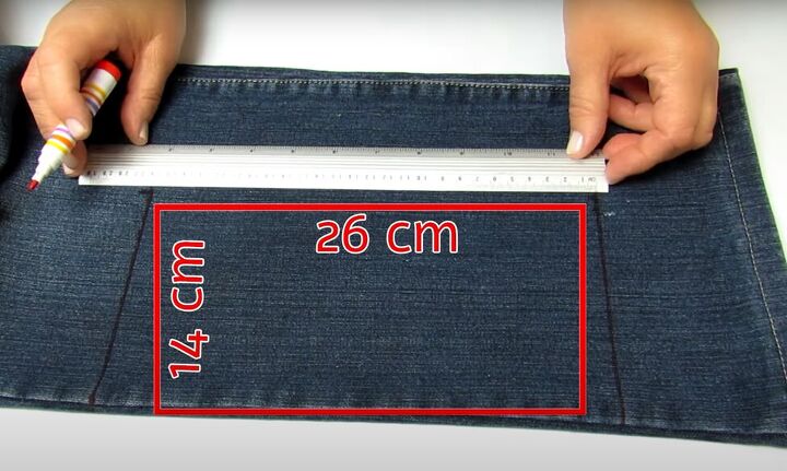 how to make a cute handmade makeup bag out of old denim, Cutting the denim pattern
