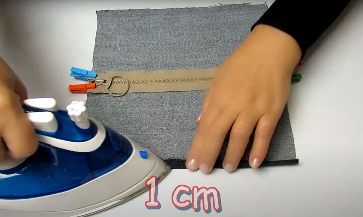 how to make a cute handmade makeup bag out of old denim, Pressing the edges with an iron