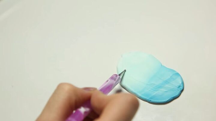 easy instructions for a gorgeous ombre feather charm with polymer clay, Sketching the basic shape of a feather onto the clay