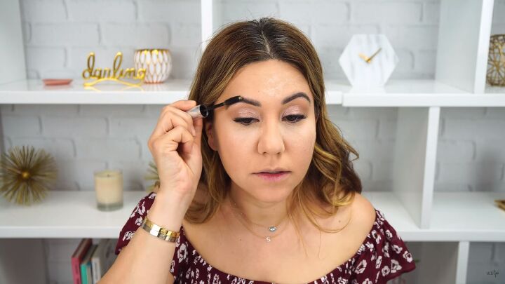 how to do simple everyday makeup you can take from day to night, Setting brows with eyebrow gel