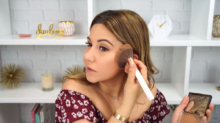 how to do simple everyday makeup you can take from day to night, Applying bronzer to the face