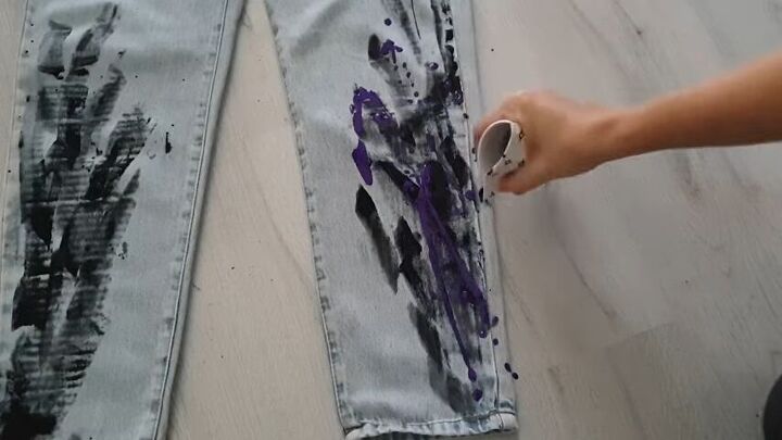 5 quick and easy steps to unique paint splatter jeans, Squeezing the top of the cup and pouring paint on the jeans
