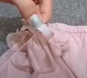 how to easily turn t shirts shirts into trendy tops, Sewing the elastic ends together