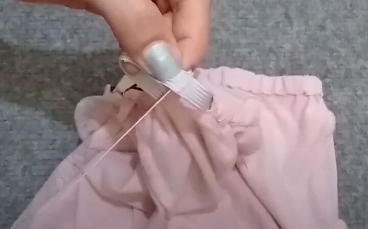 how to easily turn t shirts shirts into trendy tops, Sewing the elastic ends together